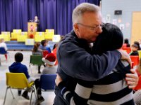 Acushnet fire chief, Kevin Gallagher, gives Collin Lopes' mother a hug on behalf of the towns citizens, as the Acushnet Fire Department and the town's schools announce the start of the 'Collin Challenge' at the Acushnet Elementary School. The "Collin Challenge", a drive to put a carbon monoxide alarm in every students home,  is named after Collin Lopes, who along with his father, Joseph Lopes, died from carbon monoxide poisoning last week at their home in Acushnet.   PETER PEREIRA/THE STANDARD-TIMES/SCMG